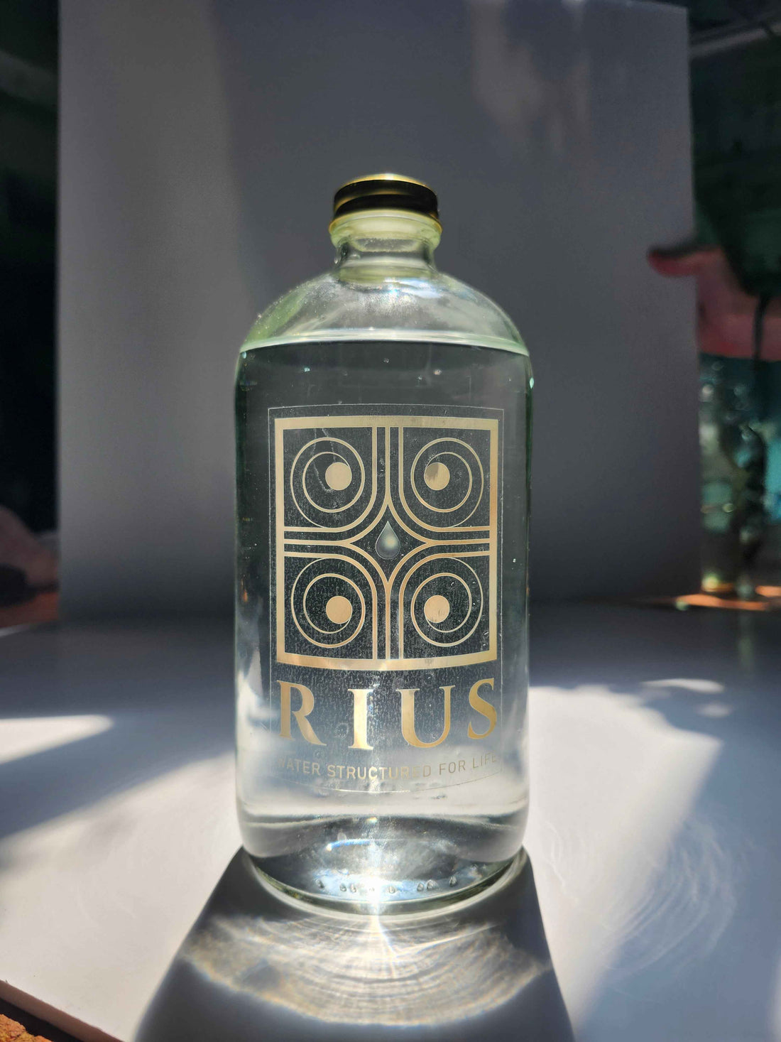 Rius structured water 34oz glass bottle, bottled in Denver Colorado