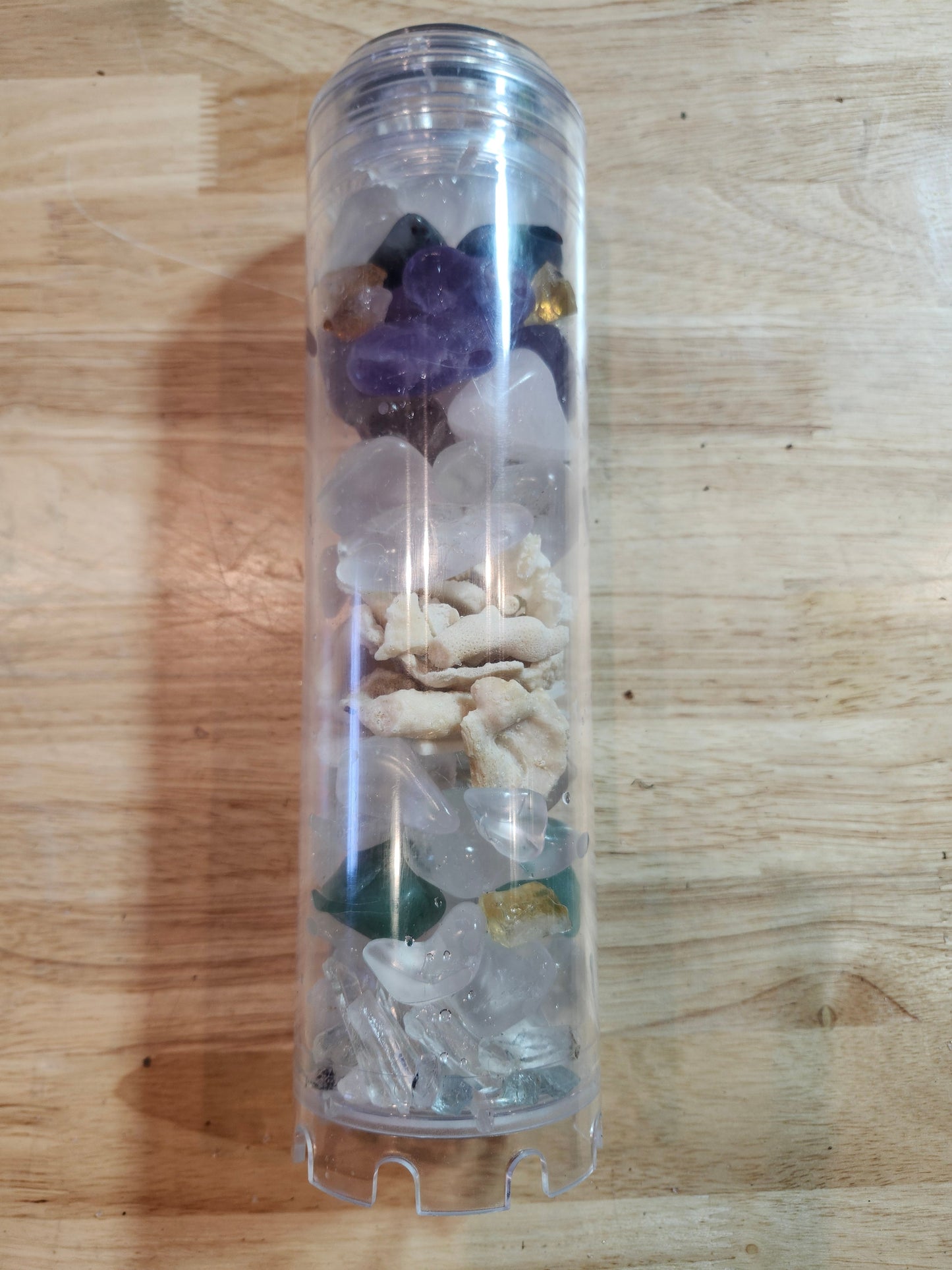 Tall clear Rius Crystal Charging Chamber filled with crystals and natural stones