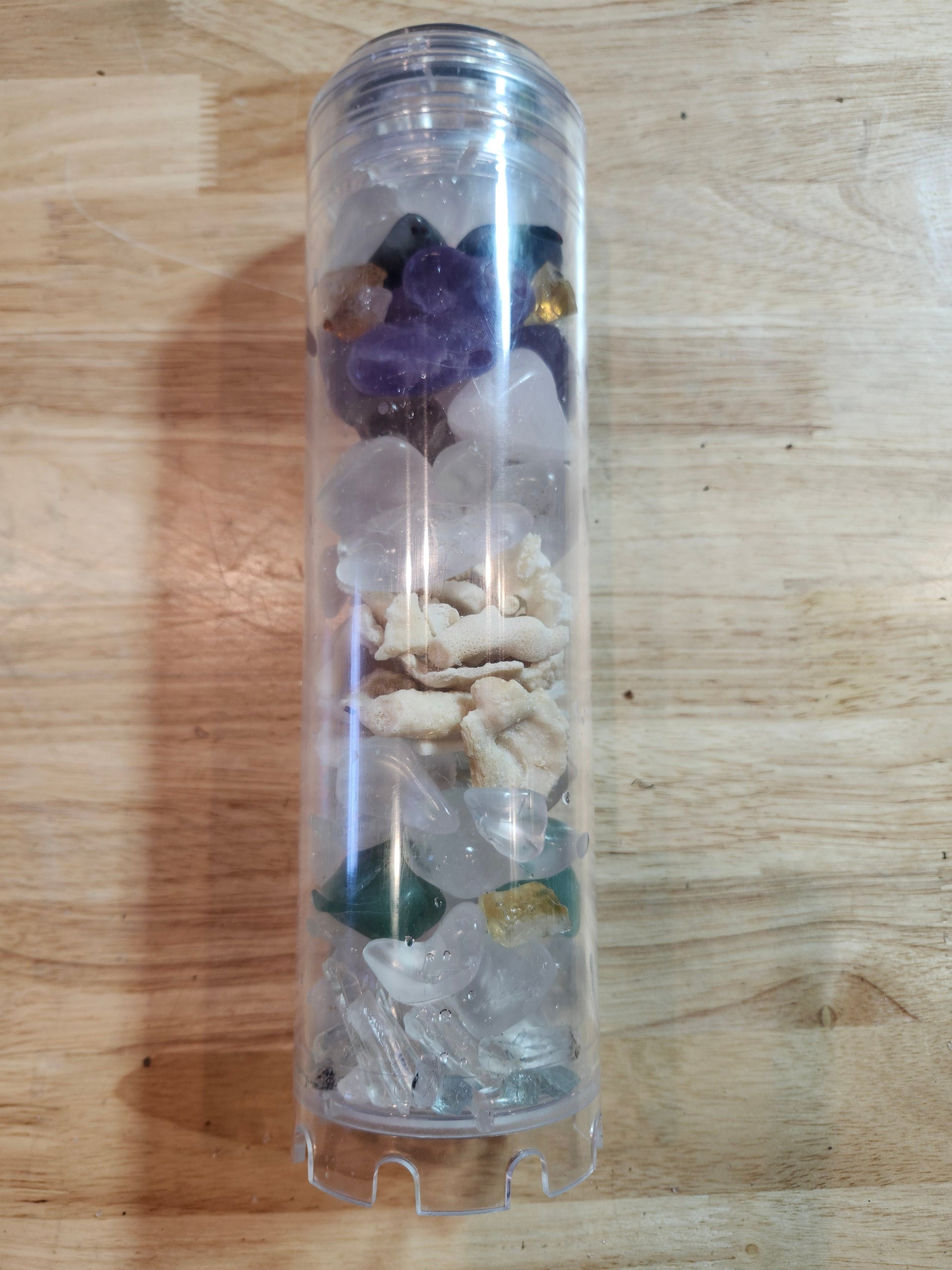 Tall clear Rius Crystal Charging Chamber filled with crystals and natural stones