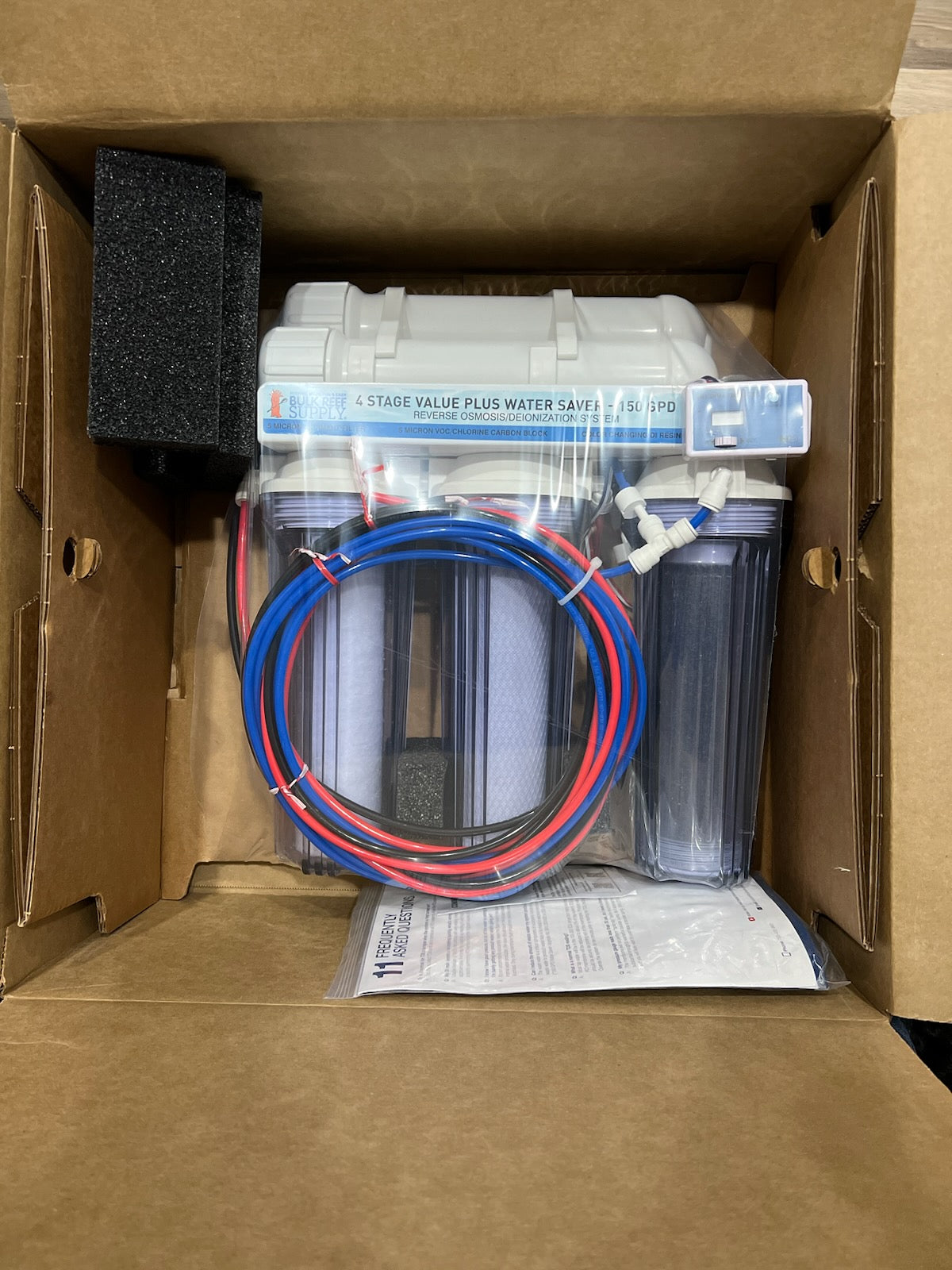 Rius reverse osmosis water system packaged in its shipping box, ready to install